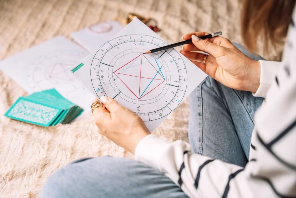 astroložka připravuje předpověď