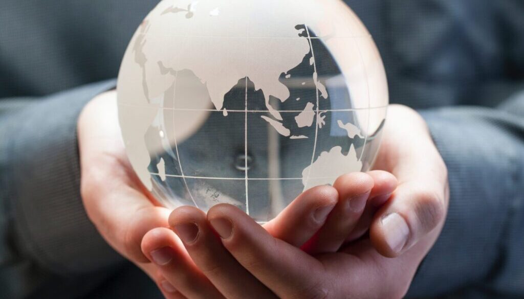 shallow focus photo of clear glass globe table ornament