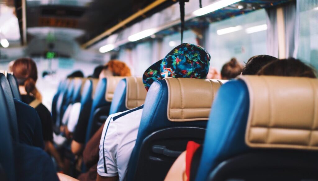 selective focus photography of people on bus