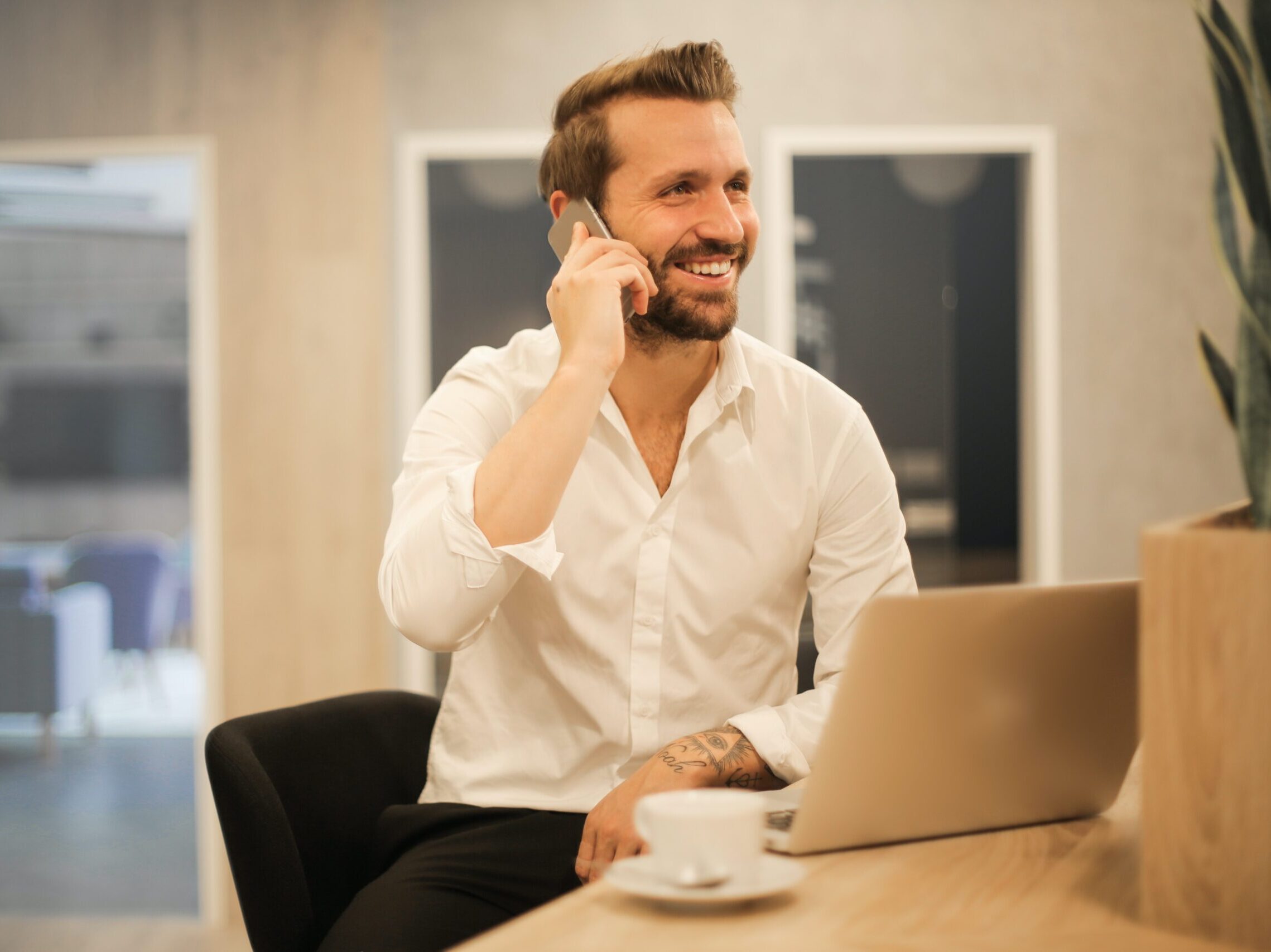 man using smartphone on chair