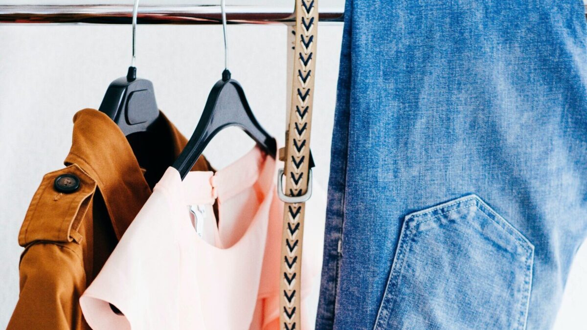 women's four assorted apparel hanged on clothes rack