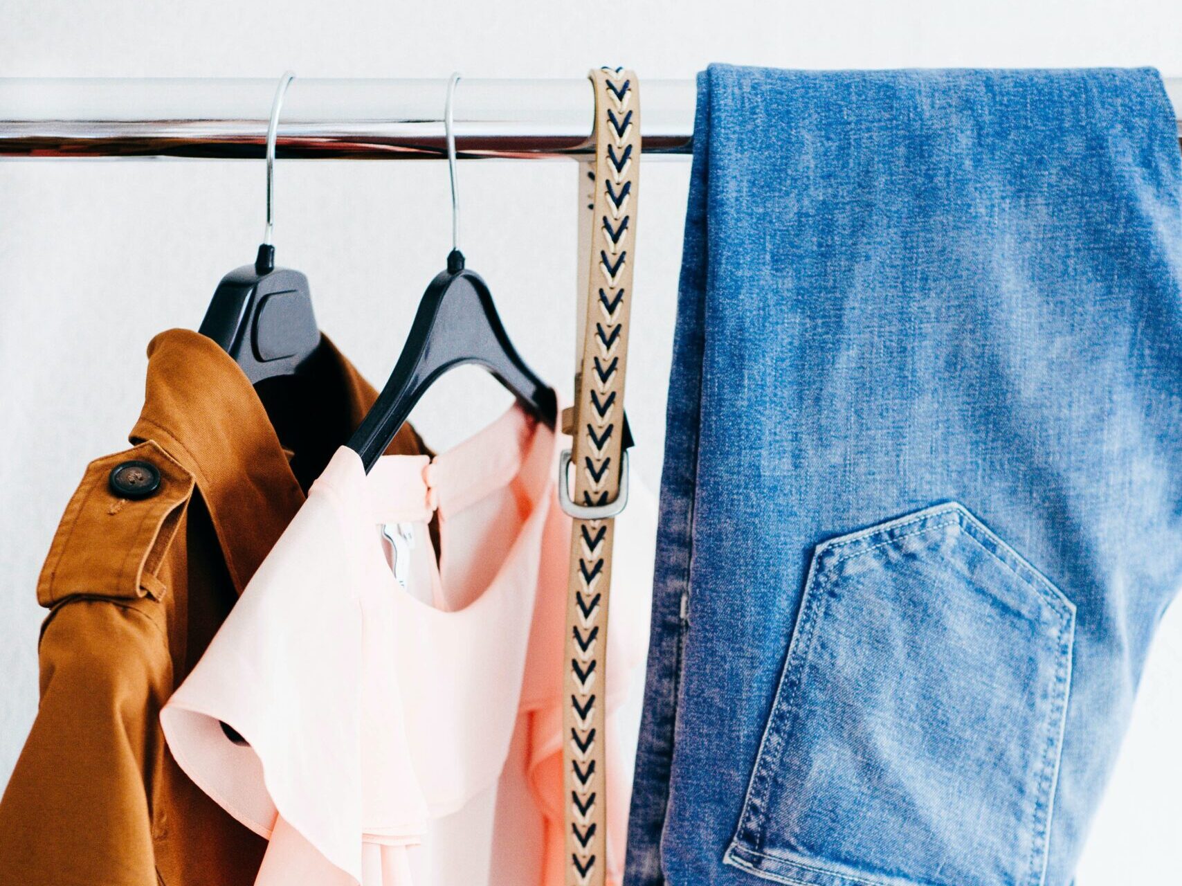 women's four assorted apparel hanged on clothes rack