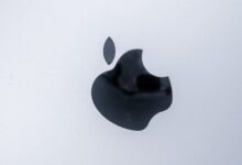 apple magic mouse on white table