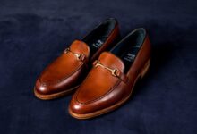 brown leather loafers on blue textile