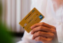 person holding credit card