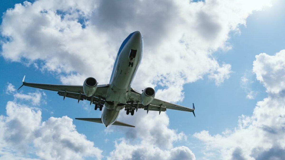 low-angle photography of airliner during flight