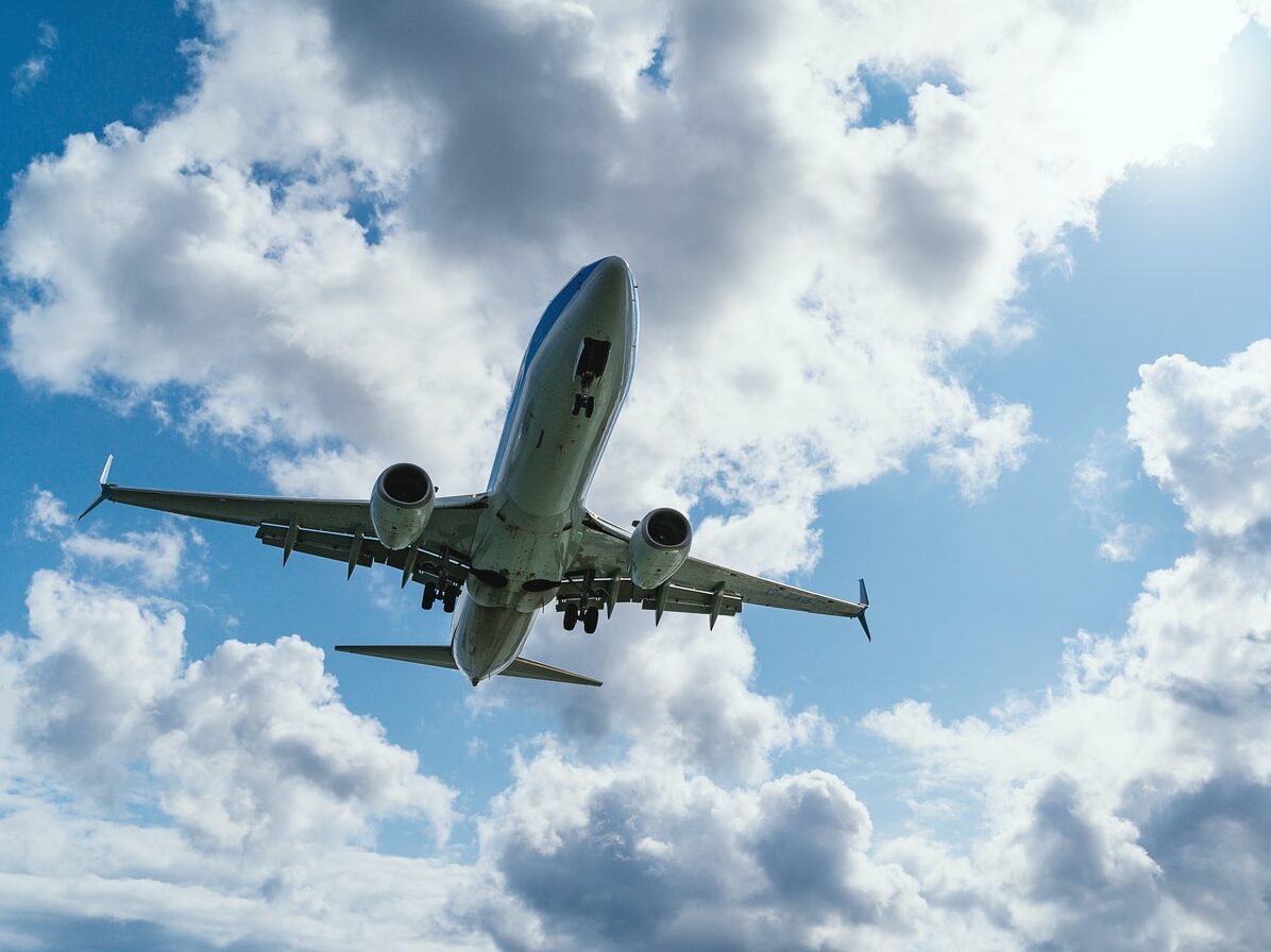 low-angle photography of airliner during flight