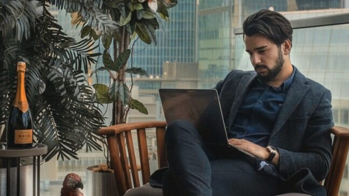 man sitting beside side table