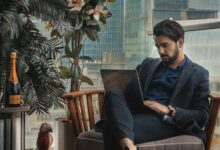 man sitting beside side table
