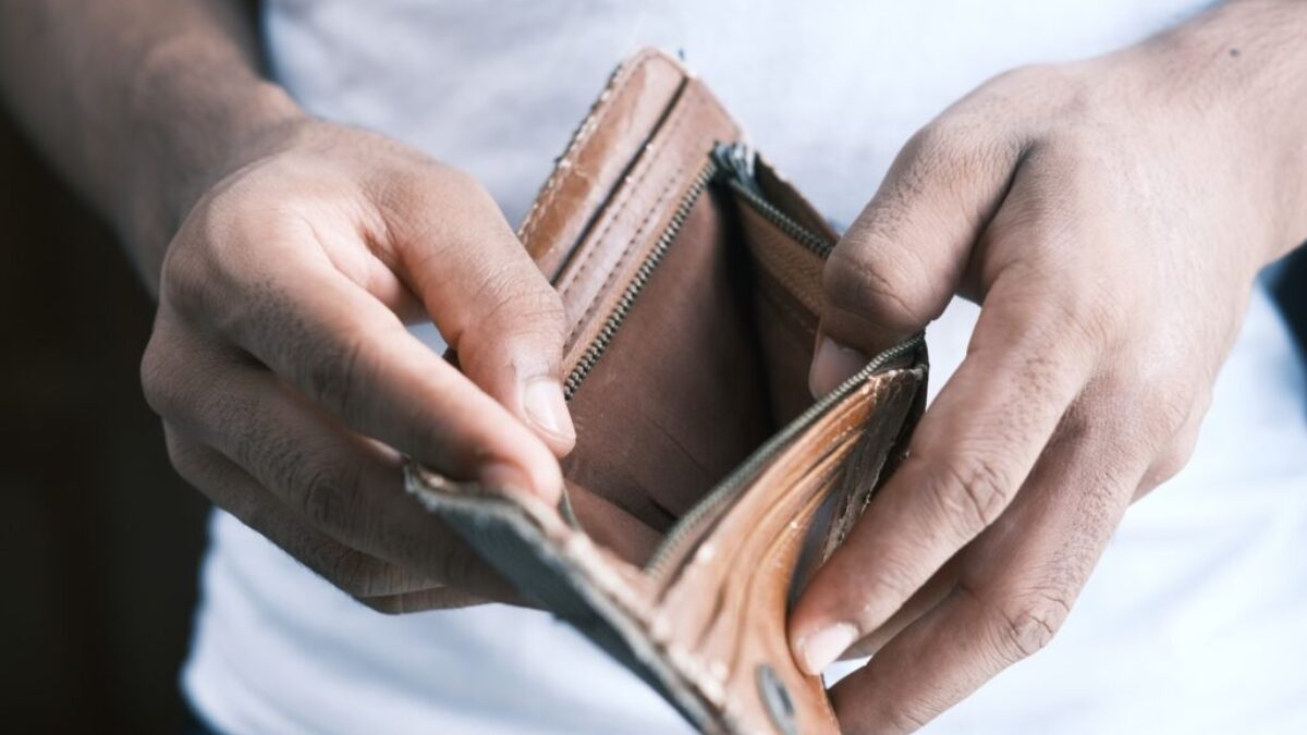 person holding brown leather bifold wallet