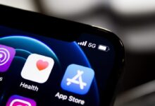 black iphone 4 displaying icons