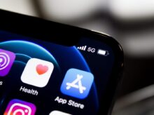 black iphone 4 displaying icons