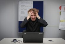 person using black laptop computer