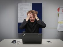 person using black laptop computer