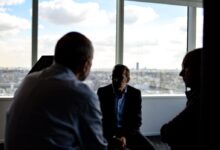 people sitting near window having conversations