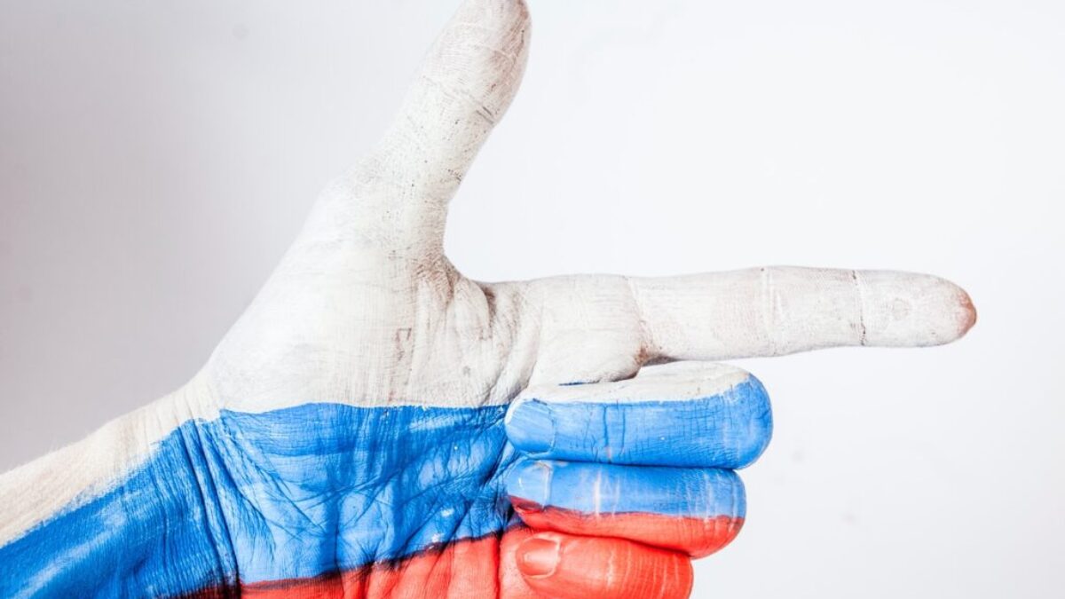 persons hand with blue paint