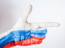 persons hand with blue paint