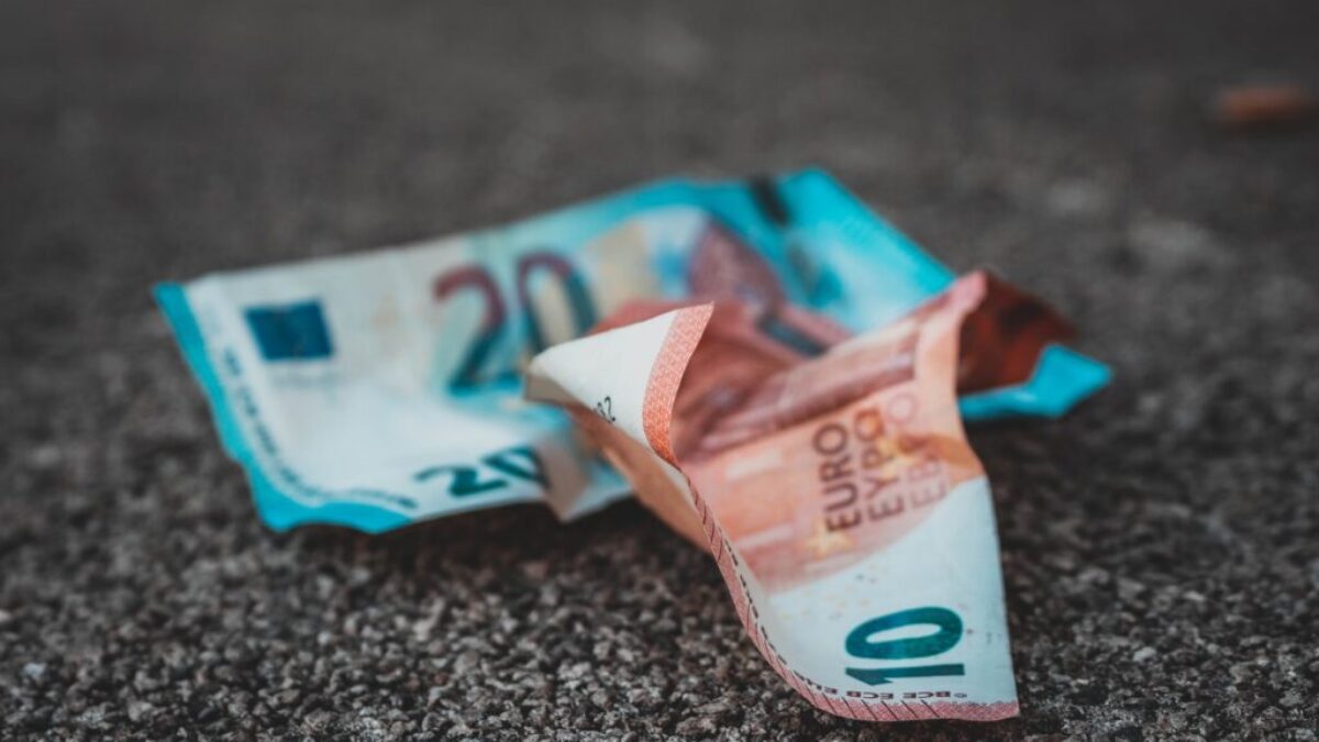 10 and 20 banknotes on concrete surface