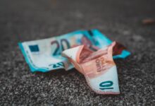 10 and 20 banknotes on concrete surface