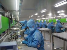 man in blue jacket wearing blue mask