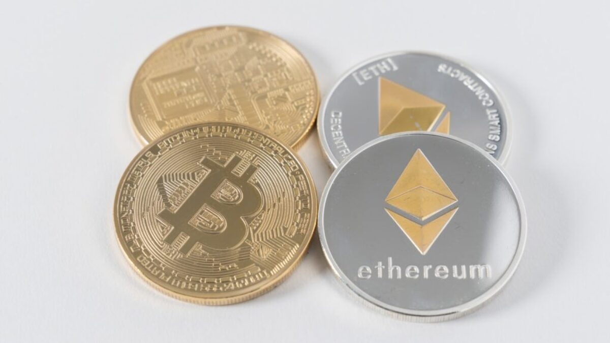 four round silver-colored and gold-colored Bitcoins