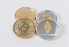 four round silver-colored and gold-colored Bitcoins