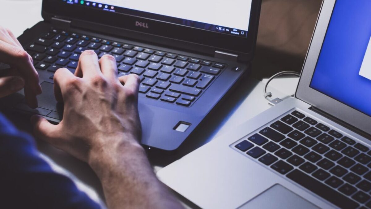 person using black laptop computer