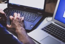 person using black laptop computer