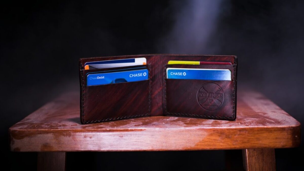 brown leather bifold wallet on table