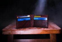 brown leather bifold wallet on table