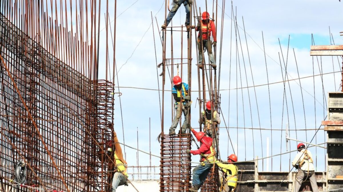 people working on building during daytime