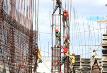 people working on building during daytime