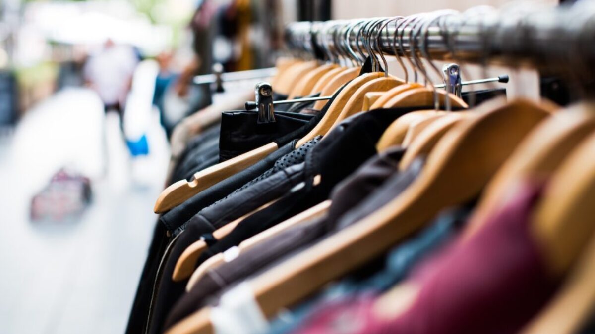 selective focus photography of hanged clothes
