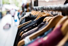 selective focus photography of hanged clothes