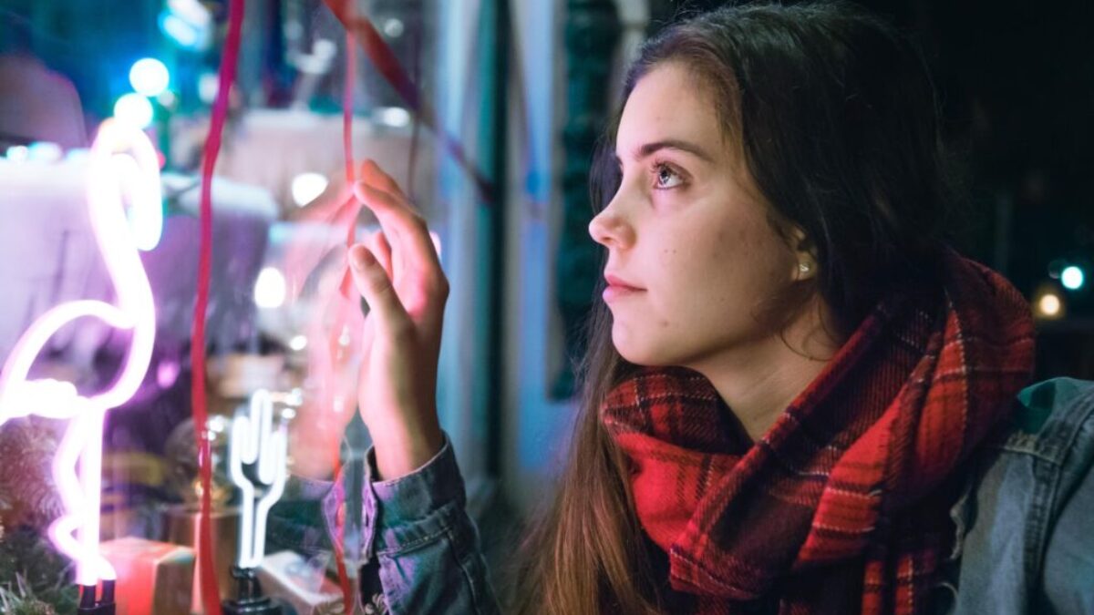 woman wearing red and black scarf