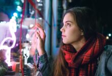 woman wearing red and black scarf
