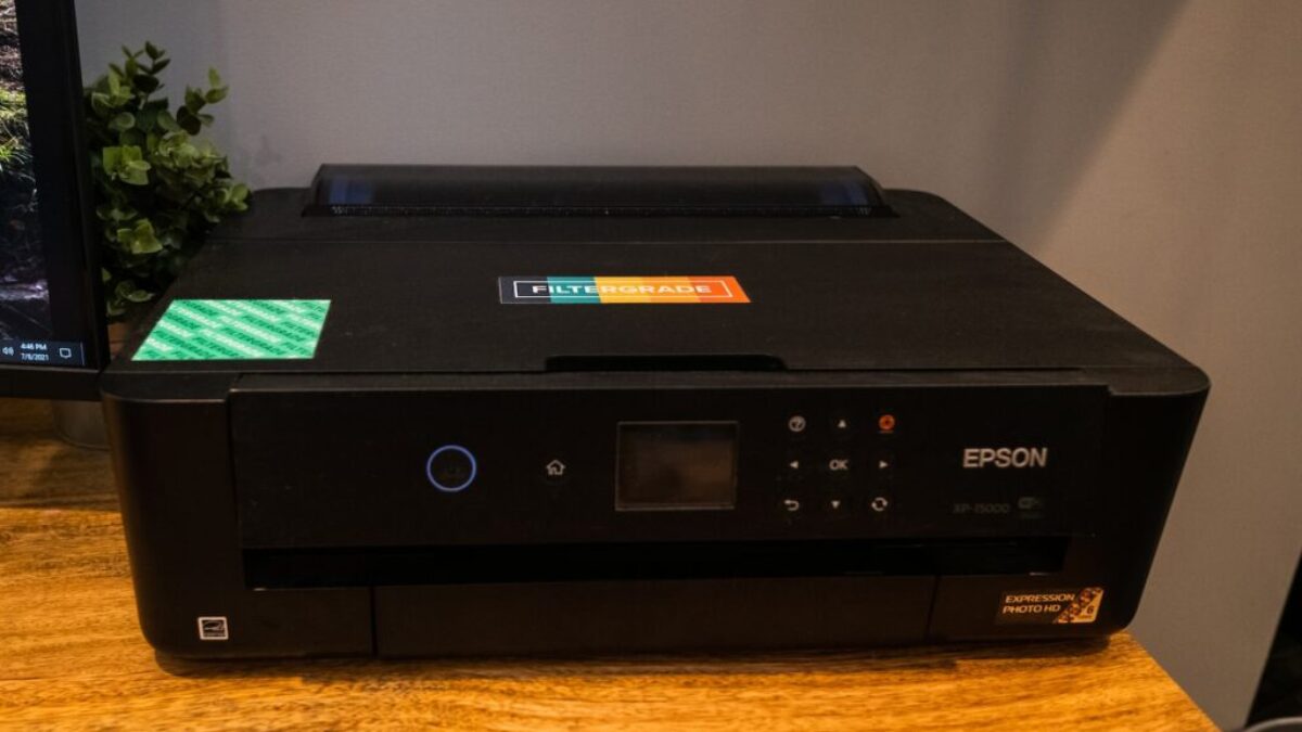 black canon printer on brown wooden table