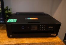 black canon printer on brown wooden table