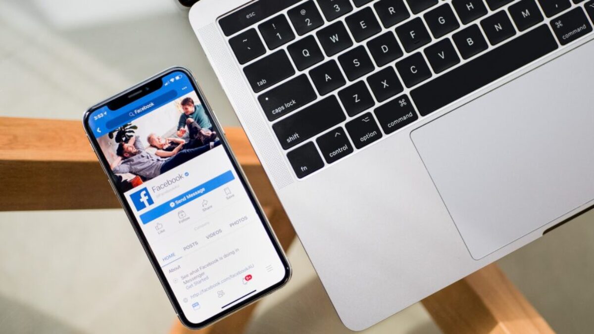 iPhone X beside MacBook
