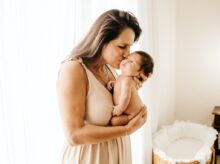 woman in white tank top kissing woman in white tank dress
