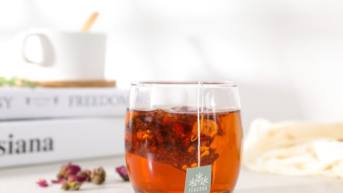 clear drinking glass with brown liquid