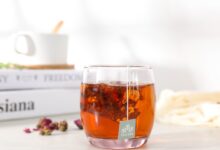clear drinking glass with brown liquid