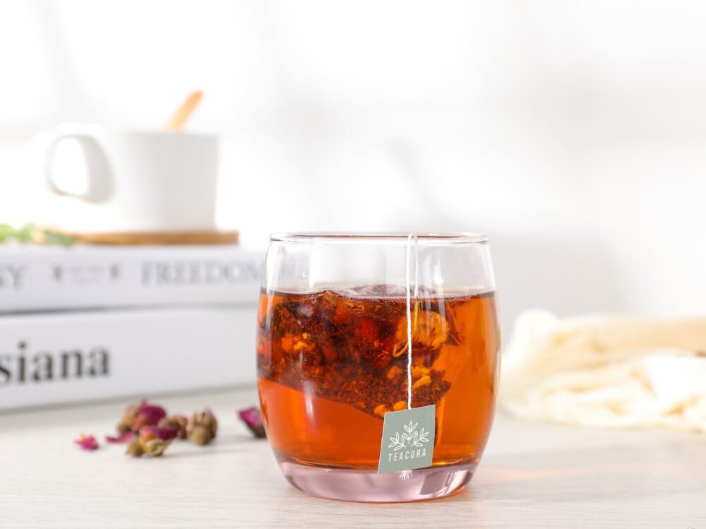 clear drinking glass with brown liquid