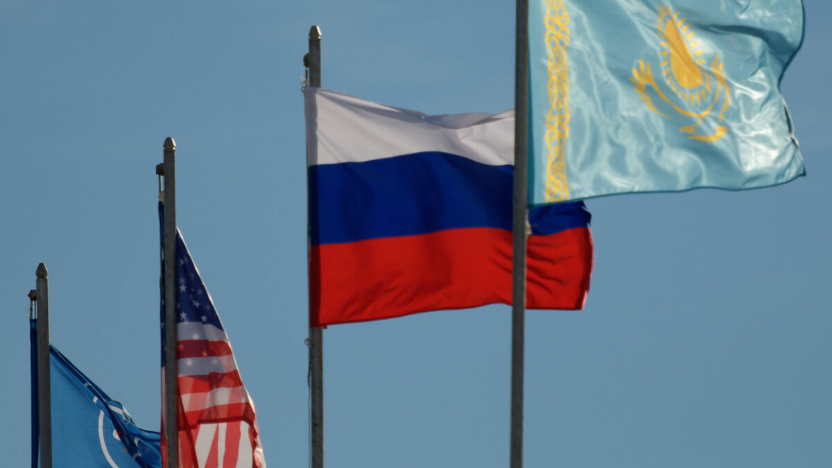 The flags of Roscosmos, the United States, Russia, and Kazakhstan are seen at the Soyuz launch pad