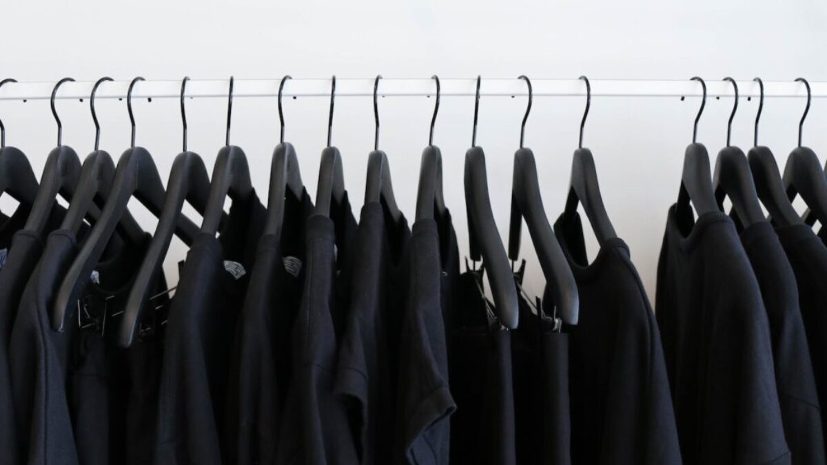 black clothes hanged in rack