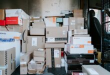 brown cardboard boxes on black plastic crate
