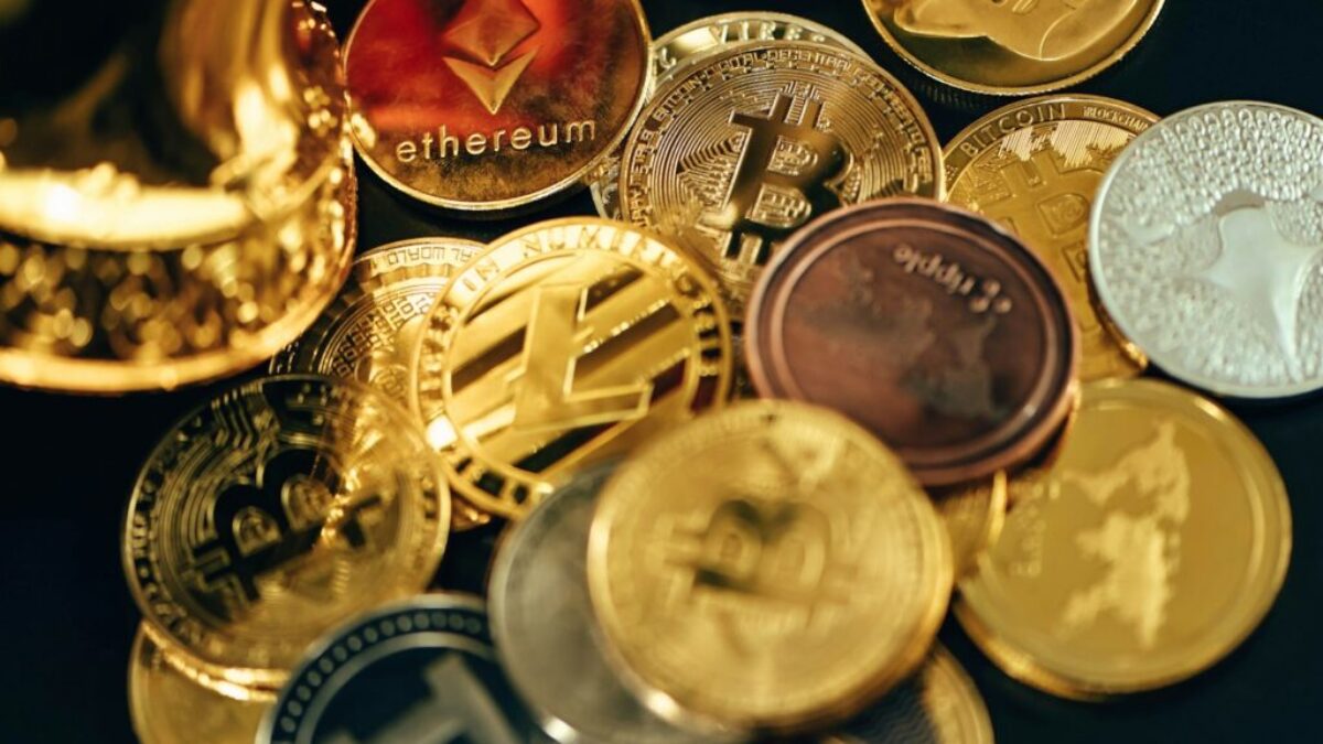 a pile of different types of coins