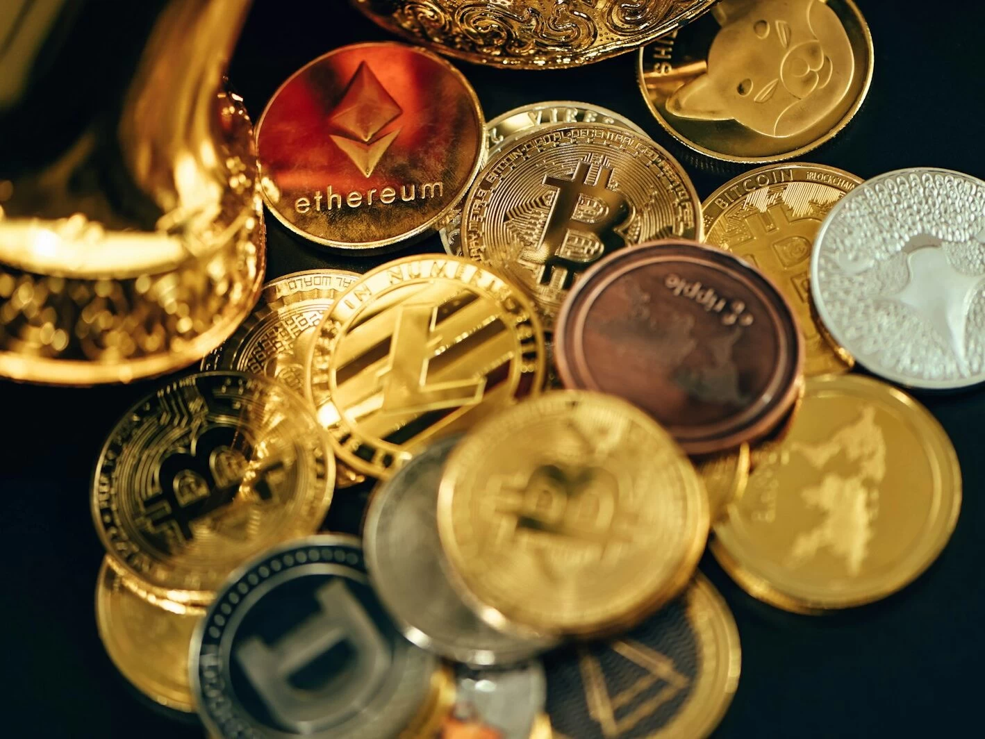 a pile of different types of coins