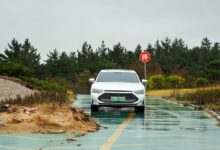 a car driving through a flooded road