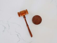 brown wooden smoking pipe on white surface